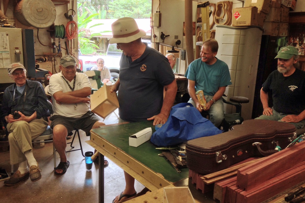 Dick Wagner passes around a box he built to stand on and to elevate projects on his workbench.