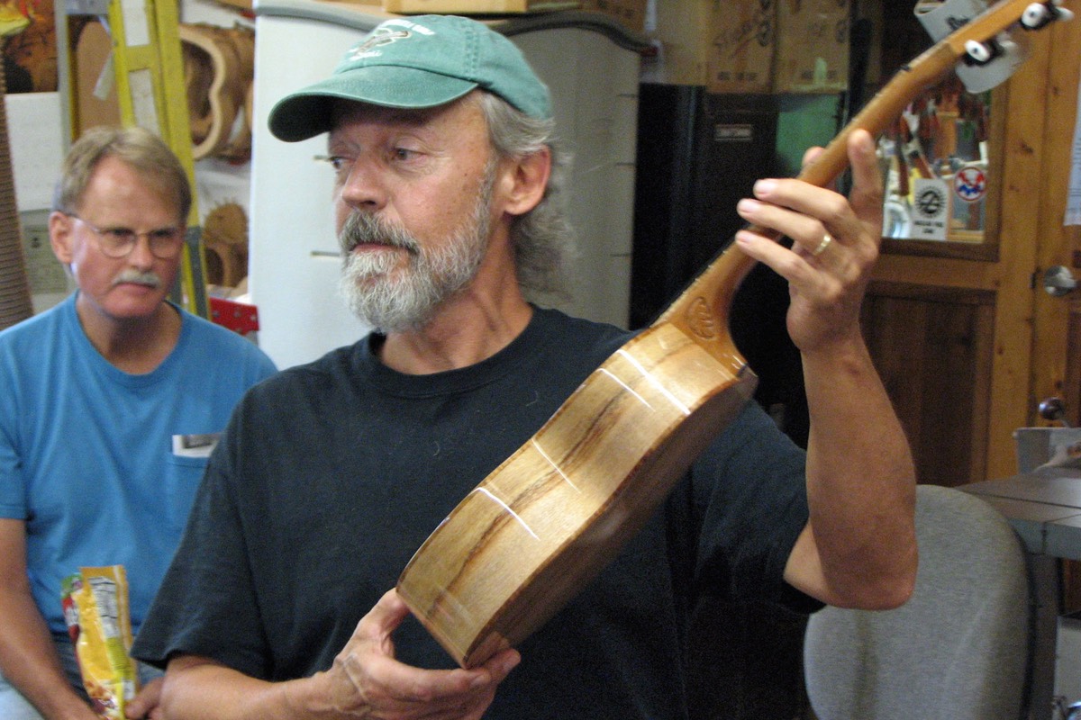Tom Parse holds an ukulele built by Bob Gleason