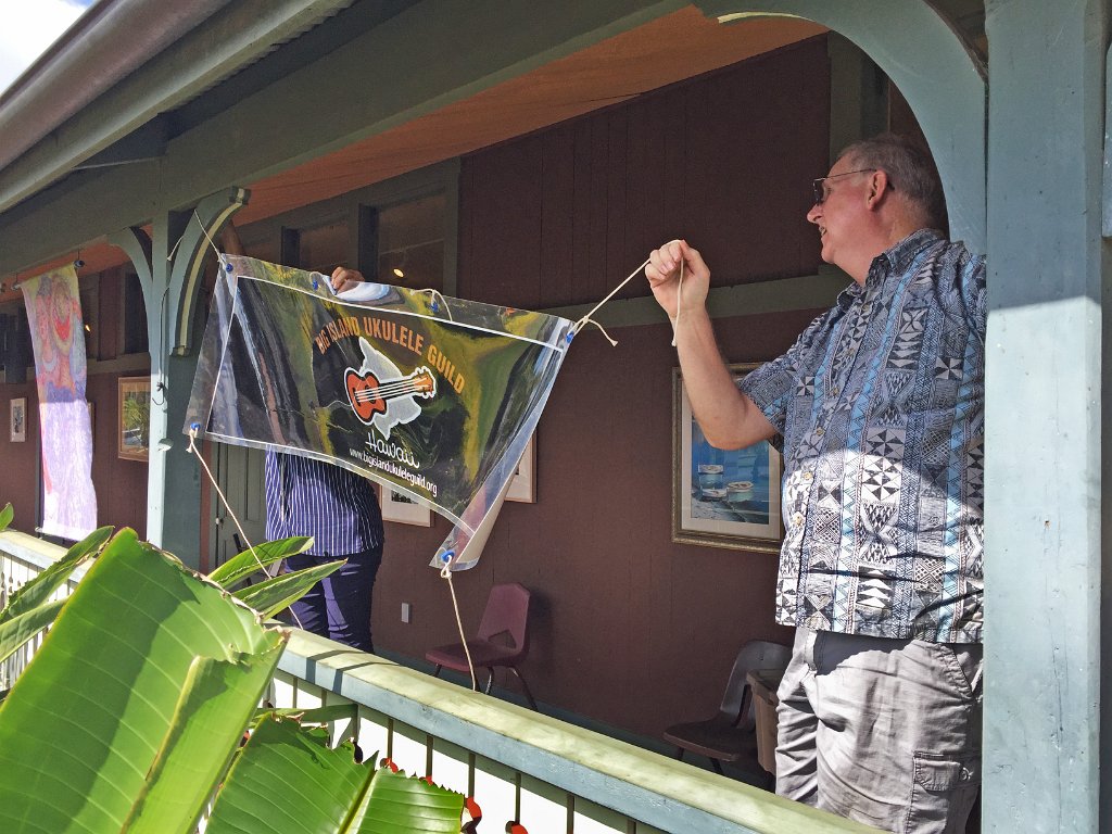 02 - Tom Russell helps hang up our banner