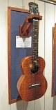 25 - Tom Russell's all curly koa tenor ukulele and ebony headstock. Gold mother of pearl, koa, yellowheart and recon stone inlay.jpg