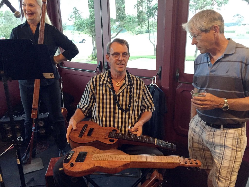 Konabob Stoffer shows off his lap steel guitars to Dave Lockard
