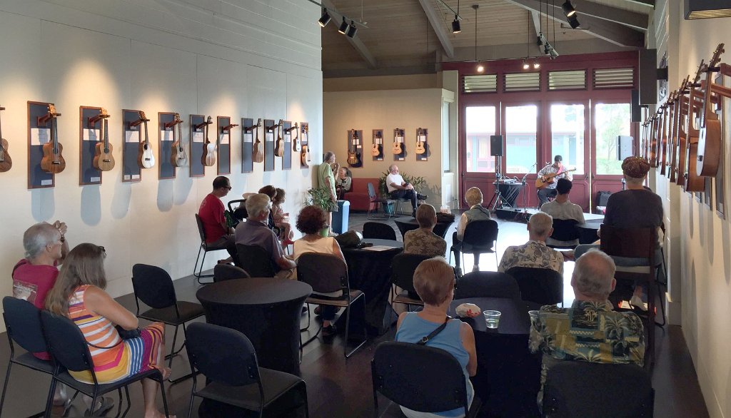 Ledward Kaapana plays slack key guitar in the exhibit gallery