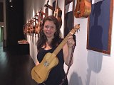 Nell Snaidas of 'El Mundo' holds her baroque guitar