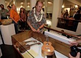 BIUG Secretary-Treasurer Bob Gleason selects an ukulele for the opening night give-away