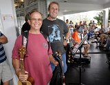 Randy Fonseca (left) of Volcano posed with BIUG Secretary-Treasurer Bob Gleason after winning an ukulele on Saturday Randy gifted the uke to visitor Cristi Bishop of Portland Oregon