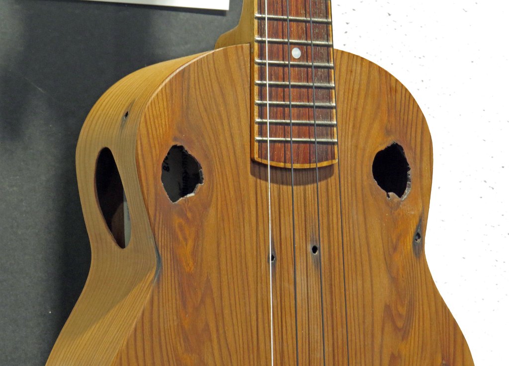 10 The natural soundholes of Bob Gleason's recycled redwood tenor ukulele