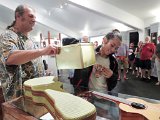 2014 Big Island Ukulele Guild exhibit 11  #11 - BIUG member and exhibit coordinator Bob Gleason helps Bryonnie Cameron, 14, draw a raffle ticket for an ukulele giveaway during the 2014 BIUG exhibit at Wailoa Center in Hilo. Bryonnie is the daughter of Hilo Guitars and Ukuleles founder Ken Cameron, who donated the ukulele.
