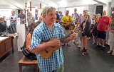 2014 Big Island Ukulele Guild exhibit 12  A beaming Daniel O’Connor strums his newly won ukulele, courtesy of Hilo Guitars and Ukuleles, which he won in a raffle at the 2014 BIUG exhibit at Wailoa Center in Hilo