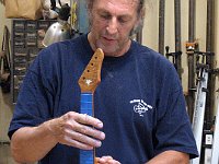 Bob Gleason shows off the fit of a dovetail neck joint
