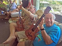 3 - VP Terry Davis (R) admires Dave Stokes's uke as Tom Russell preps his for show and tell.