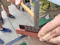 17 - 16 - Mike Perdue uses an old bridge with nails for marking his tie block bridges